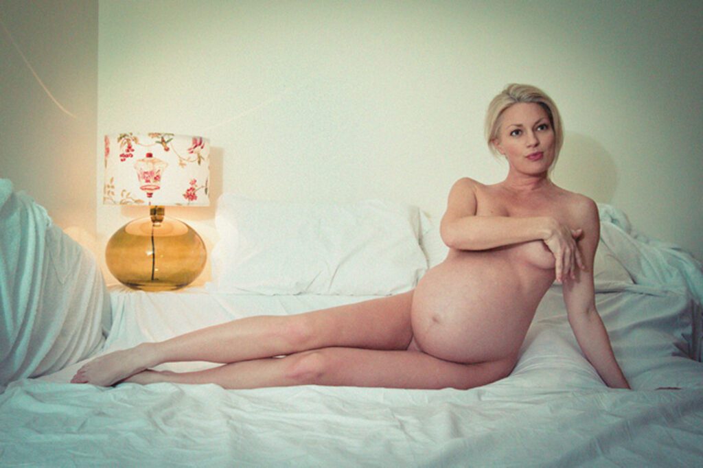 Maternity s elf portrait in bed, 9 months pregnant, 6 days befor